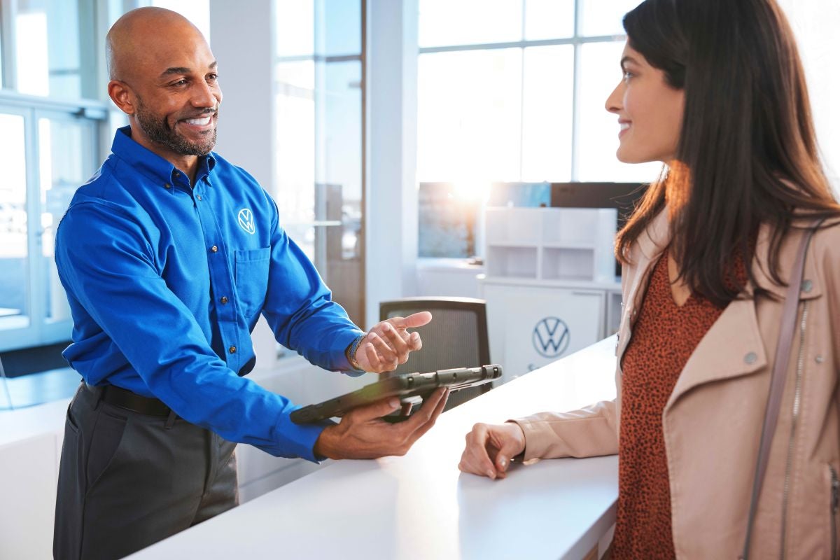 Volkswagen Service Counter Consultant helping a customer